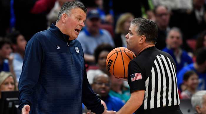Creighton head coach Greg McDermott speaks with an official during a 2023 Elite Eight game against San Diego State